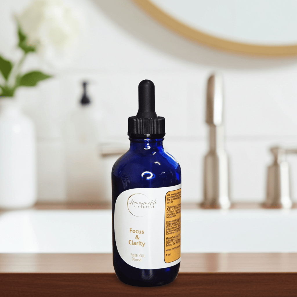 Blue bottle with dropper labeled 'Focus & Clarity' on a bathroom counter.