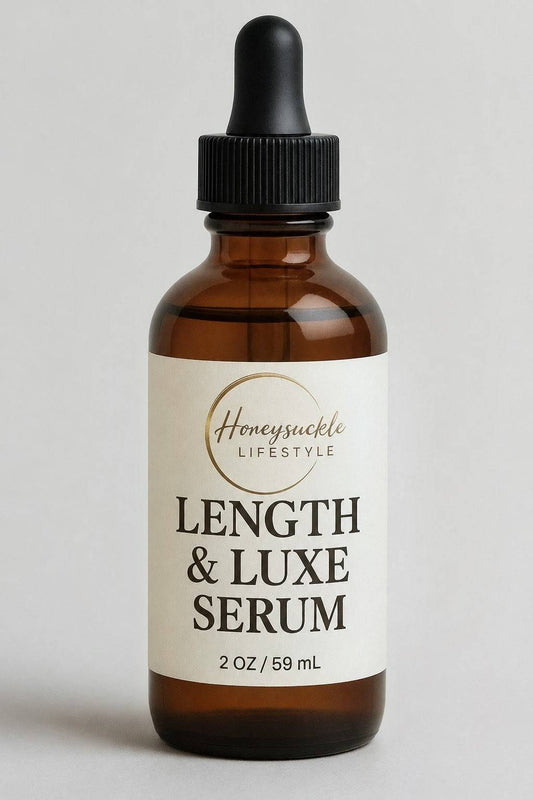 Bottle of 'Length & Luxe Serum' with a dropper labeled 'Honeysuckle Lifestyle' on a light gray background.
