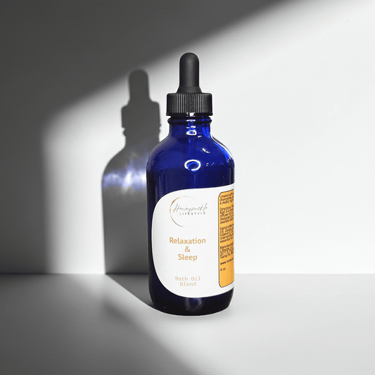 Blue glass bottle with dropper labeled 'Sleep' on a gray background