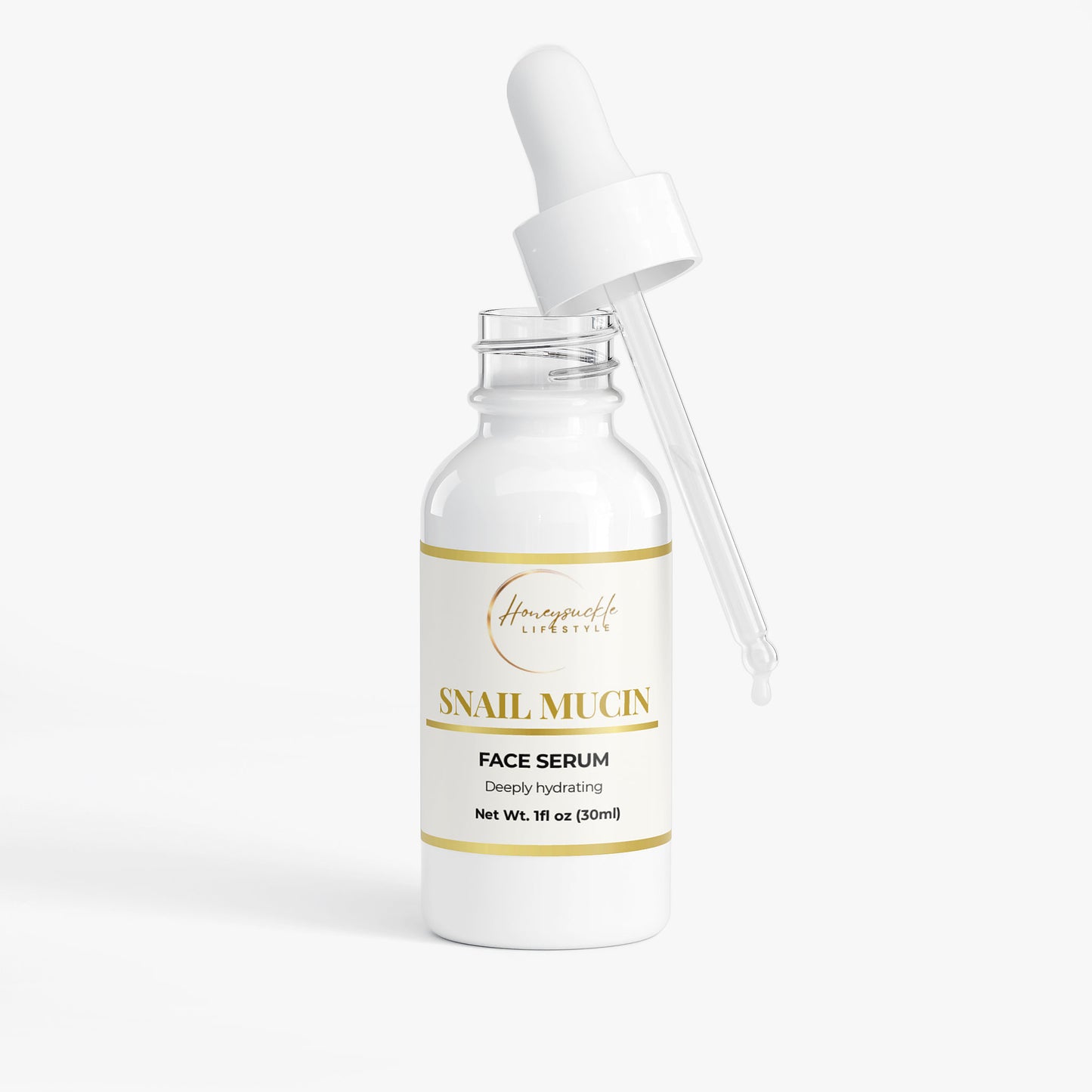 Snail mucin face serum bottle with dropper on a white background