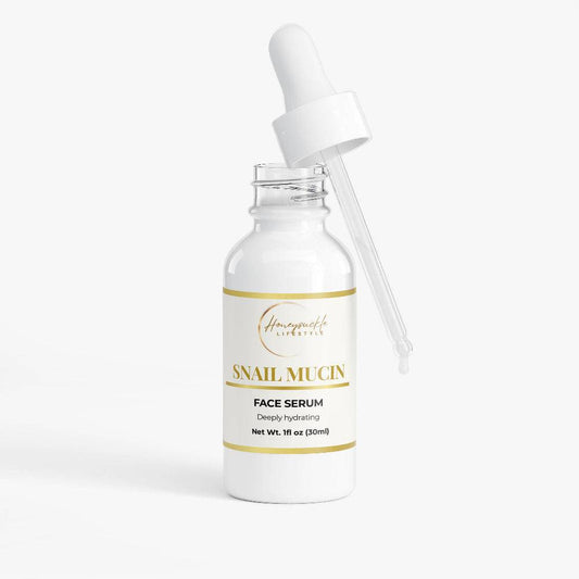 Snail mucin face serum bottle with dropper on a white background