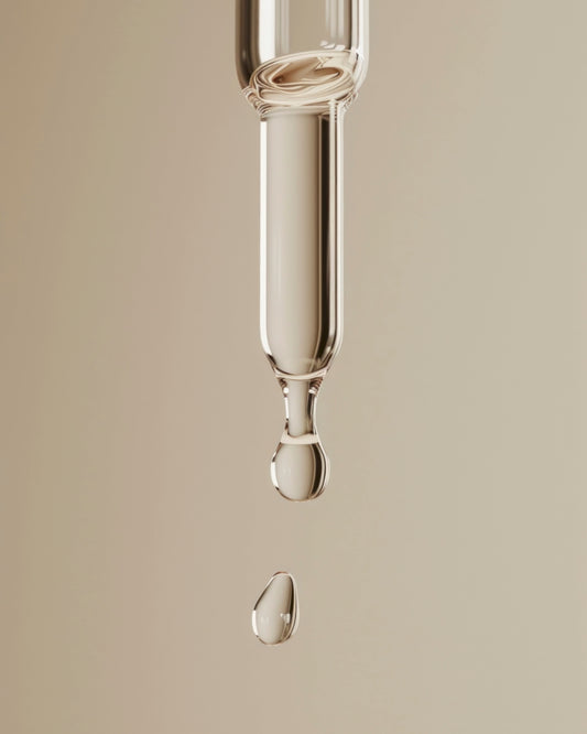 Rich facial serum flowing from a dropper