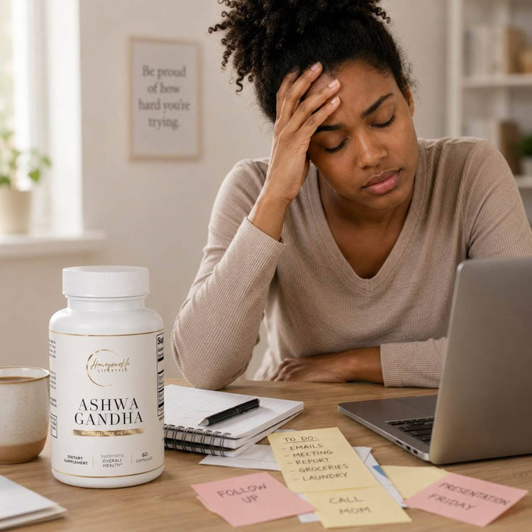 Woman sitting at a desk with a laptop and Ashwagandha supplement bottle, appearing stressed.