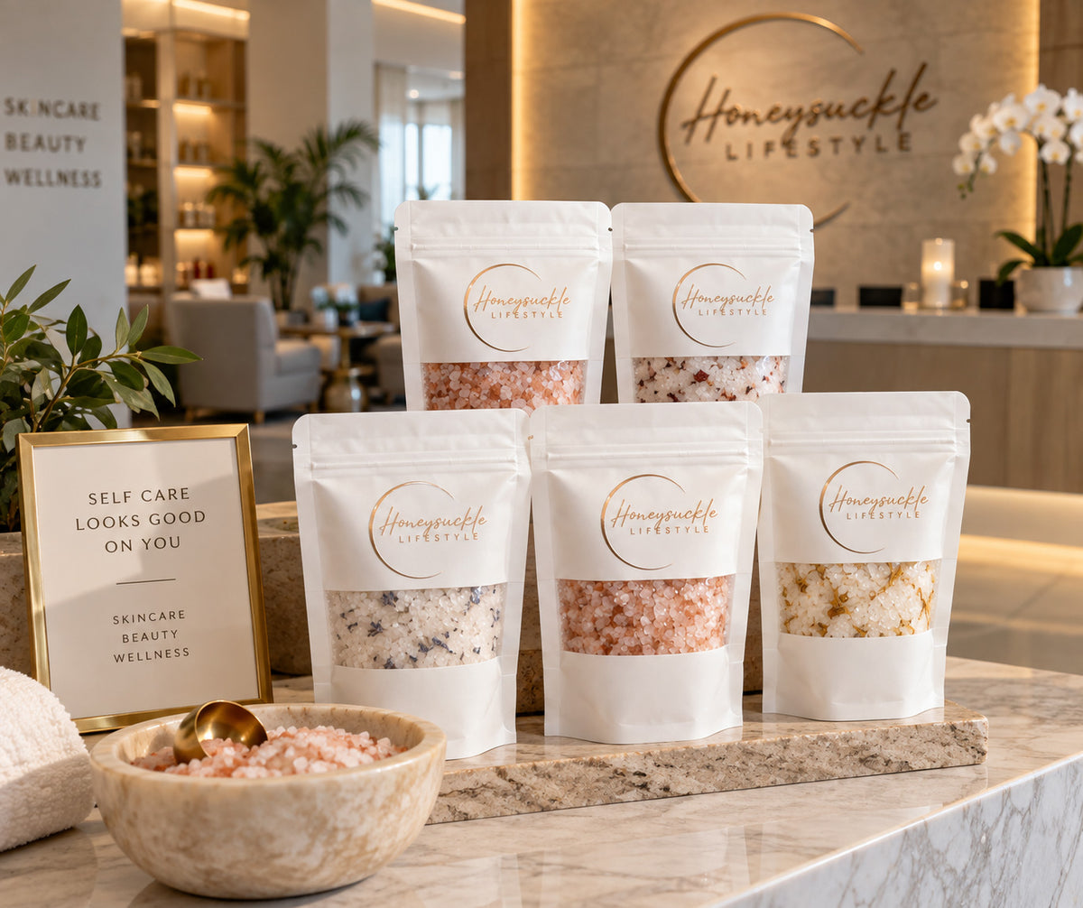 Relaxing image of HoneySuckle Lifestyle luxury sea salt bath soak in a bowl, showcasing textured bath salts for a calming bath experience.