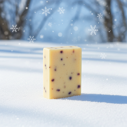 Bar of soap with blackberries on a snowy background