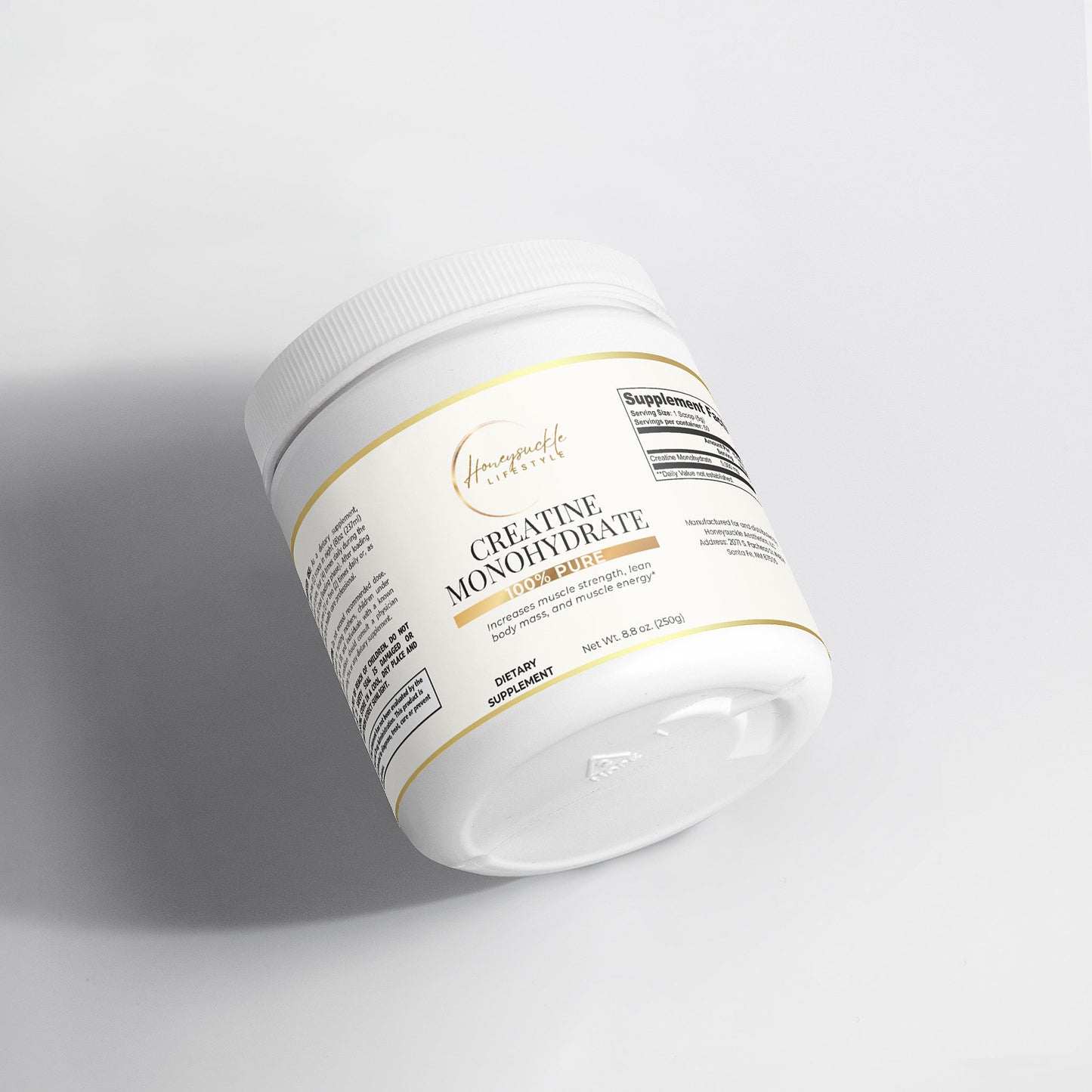 White supplement container with gold text on a light gray background