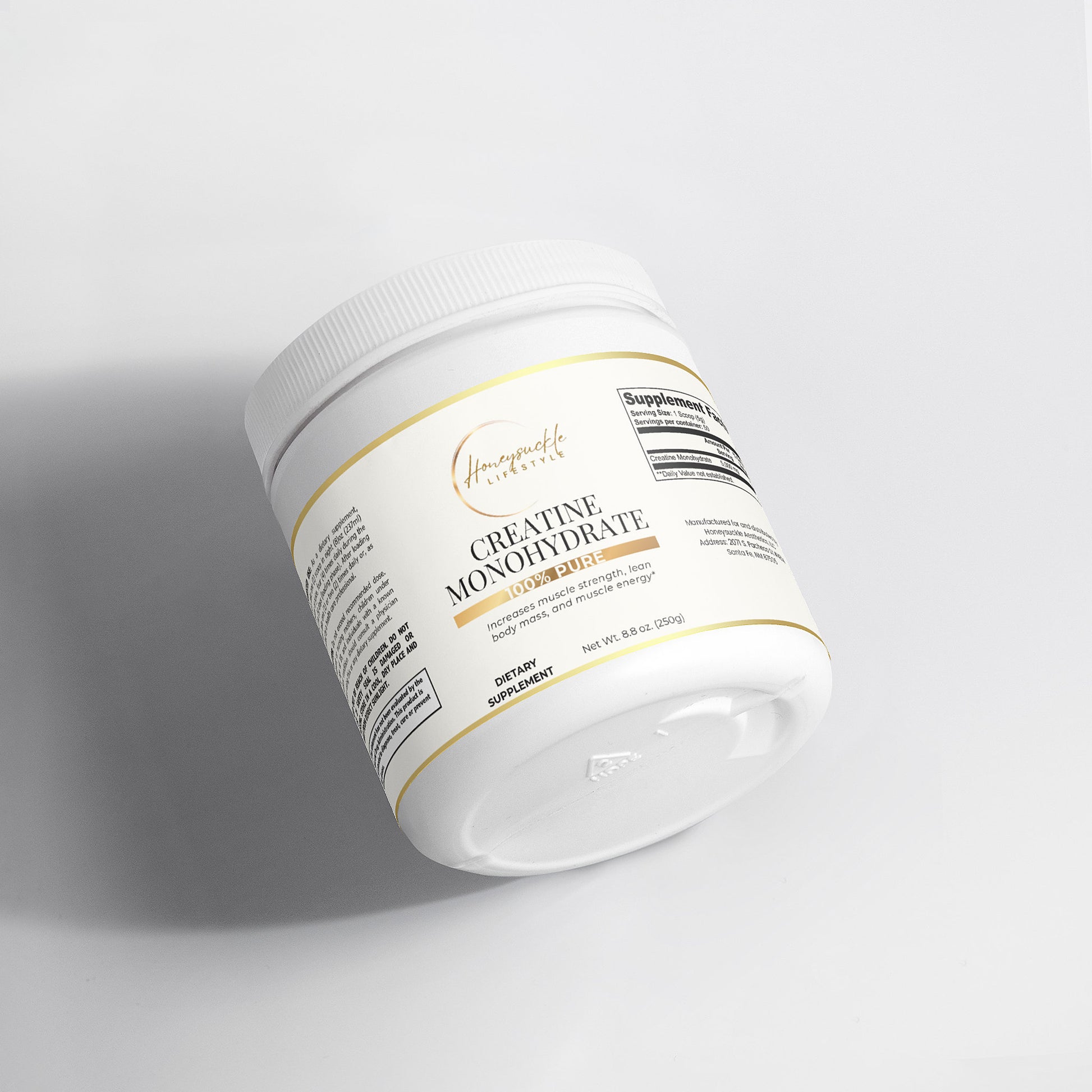 White supplement container with gold text on a light gray background