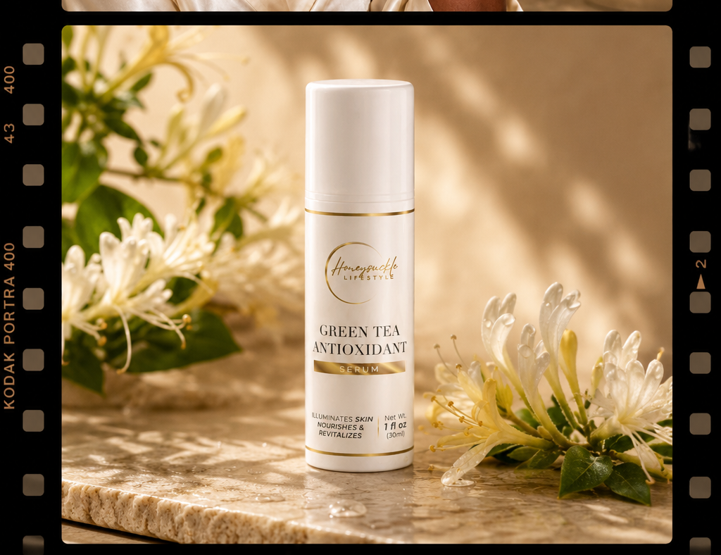 Woman with closed eyes and a bottle of skincare product on a marble surface with flowers.