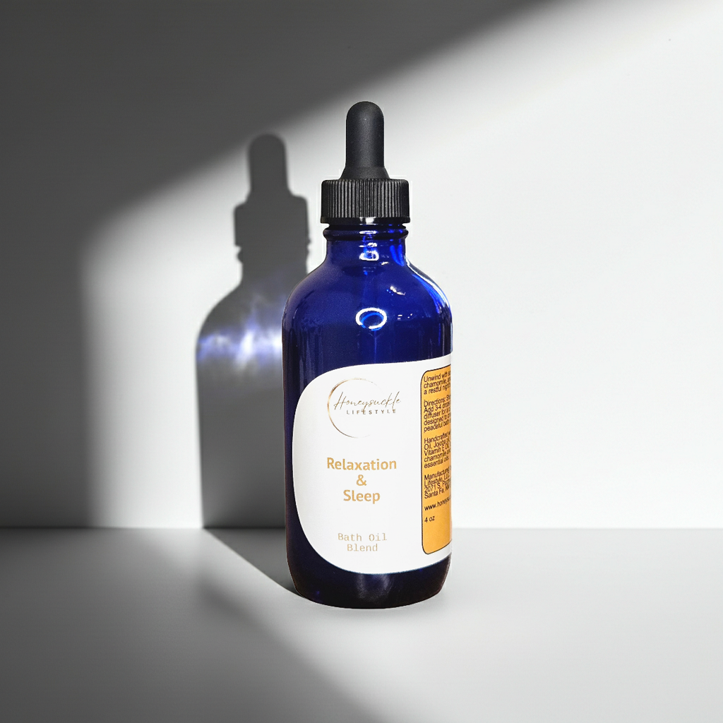 Blue glass bottle with dropper labeled 'Sleep' on a gray background