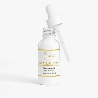 Snail mucin face serum bottle with dropper on a white background