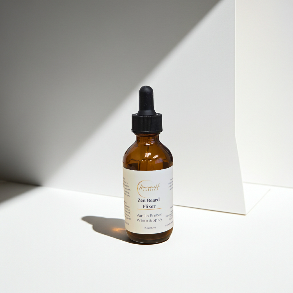 Brown glass bottle with dropper labeled 'Zen Beard Elixer' on a white background